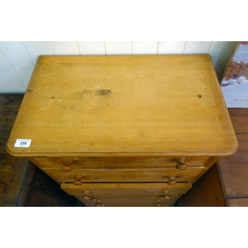 258 - A modern pine tall boy, comprising six drawers with bun  handles, on a plinth  42