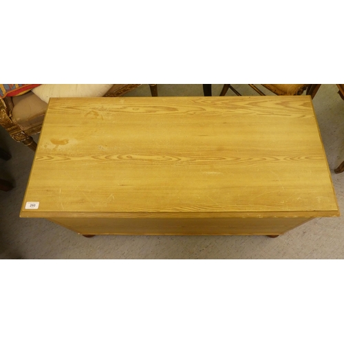 260 - A modern pine blanket chest, raised on bun feet  19.5