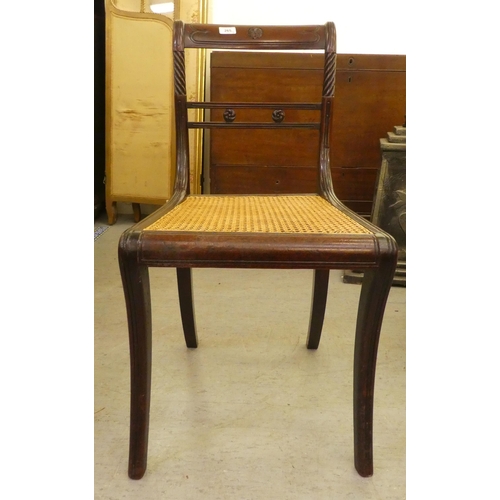 265 - Small furniture: to include a Regency mahogany framed dining chair with a cane seat, raised on sabre... 