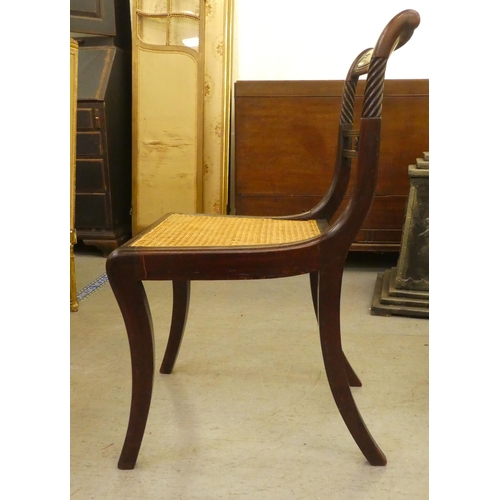 265 - Small furniture: to include a Regency mahogany framed dining chair with a cane seat, raised on sabre... 