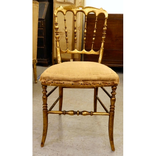 265 - Small furniture: to include a Regency mahogany framed dining chair with a cane seat, raised on sabre... 