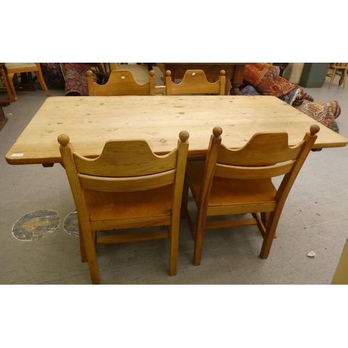 271 - A modern pine, farmhouse style dining table, raised on crossed legs, united by a stretcher  27.... 