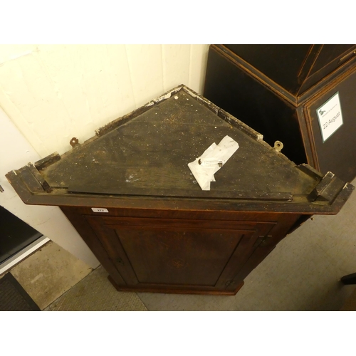 272 - A mid 19thC oak hanging corner cabinet, the hinged door inlaid with a flowering vase design, enclosi... 