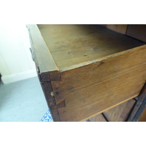 278 - A mid 18thC walnut dressing chest with two short/three long drawers, raised on bracket feet  35... 