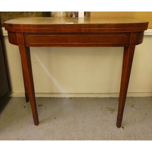 279 - A Regency satinwood inlaid mahogany card table, the foldover top enclosing a baize lined interior, r... 