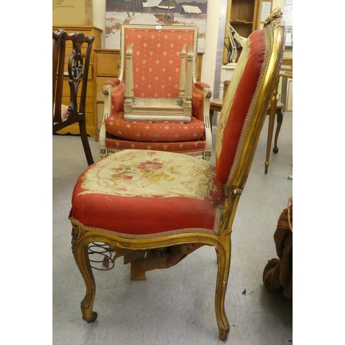 280 - A late 19thC Louis XV design, giltwood framed salon chair with a tapestry upholstered back and seat,... 