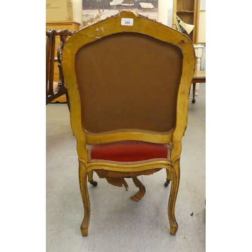 280 - A late 19thC Louis XV design, giltwood framed salon chair with a tapestry upholstered back and seat,... 