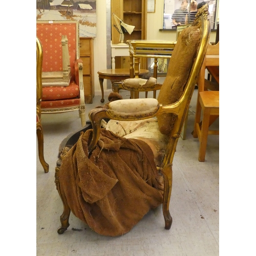 280 - A late 19thC Louis XV design, giltwood framed salon chair with a tapestry upholstered back and seat,... 