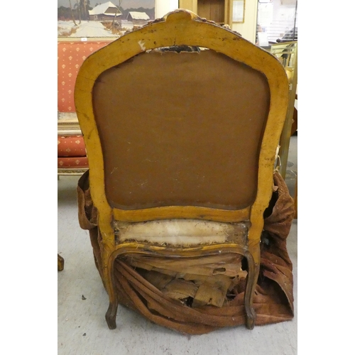 280 - A late 19thC Louis XV design, giltwood framed salon chair with a tapestry upholstered back and seat,... 