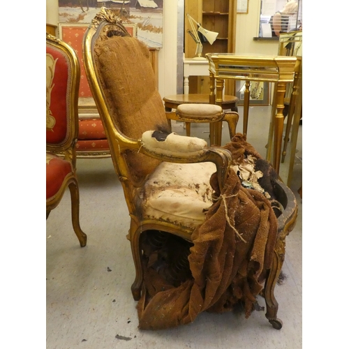 280 - A late 19thC Louis XV design, giltwood framed salon chair with a tapestry upholstered back and seat,... 