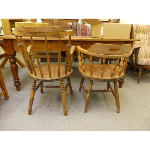 281 - An early 20thC beech framed captain's chair, the tapered bar back over a circular seat, raised on tu... 