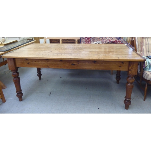 292 - A modern pine farmhouse dining table with a plank constructed top, raised on turned, tapered legs&nb... 