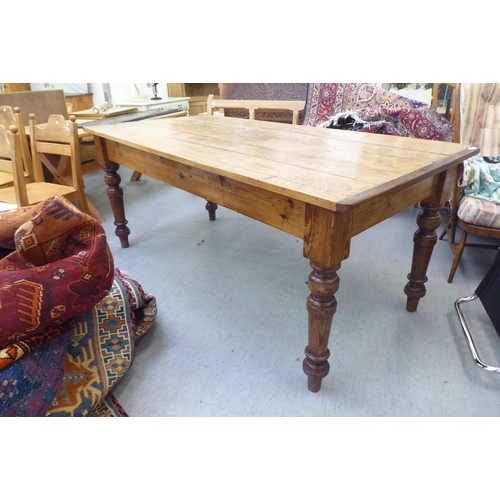 292 - A modern pine farmhouse dining table with a plank constructed top, raised on turned, tapered legs&nb... 