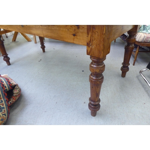 292 - A modern pine farmhouse dining table with a plank constructed top, raised on turned, tapered legs&nb... 