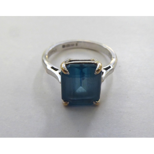 294 - A 9ct white gold ring, set with an octagon cut blue topaz