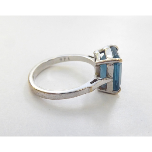 294 - A 9ct white gold ring, set with an octagon cut blue topaz