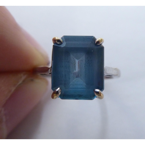 294 - A 9ct white gold ring, set with an octagon cut blue topaz