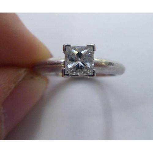 295 - A platinum solitaire ring, set with a princess cut diamond