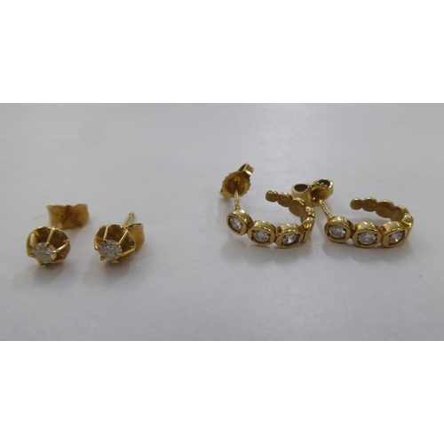 298 - Two pairs of 18ct gold earrings, each set with diamonds