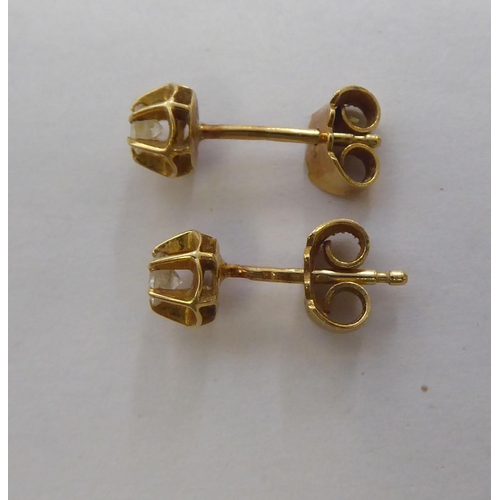 298 - Two pairs of 18ct gold earrings, each set with diamonds