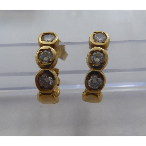 298 - Two pairs of 18ct gold earrings, each set with diamonds