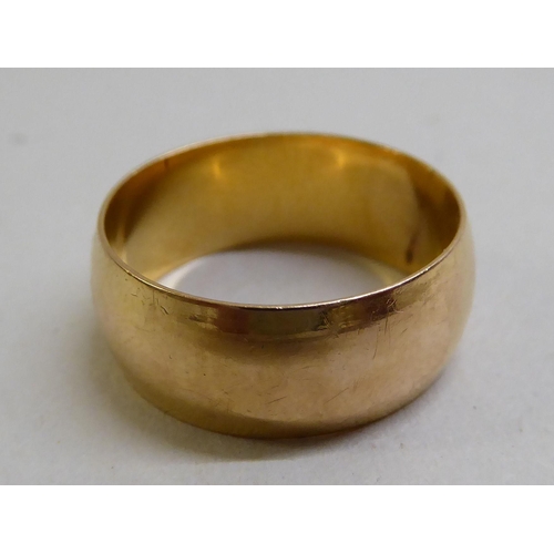 3 - A yellow metal wedding ring