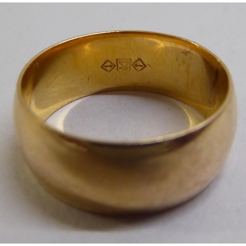 3 - A yellow metal wedding ring