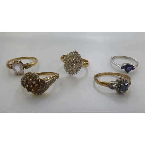 300 - Five 9ct gold dress rings: to include a cluster ring, set with a central blue stone, surrounded by d... 