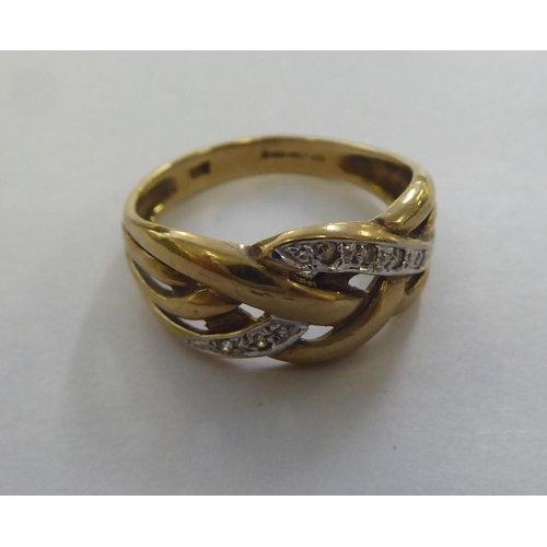 305 - A 9ct gold ring of woven design, set with diamonds