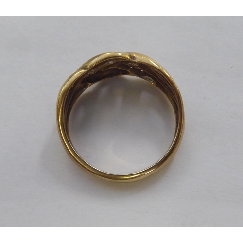 305 - A 9ct gold ring of woven design, set with diamonds