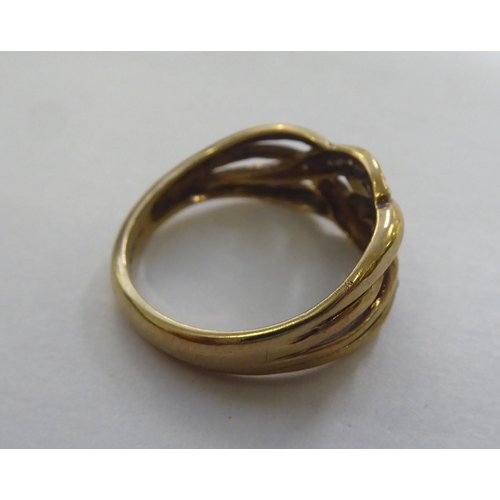 305 - A 9ct gold ring of woven design, set with diamonds