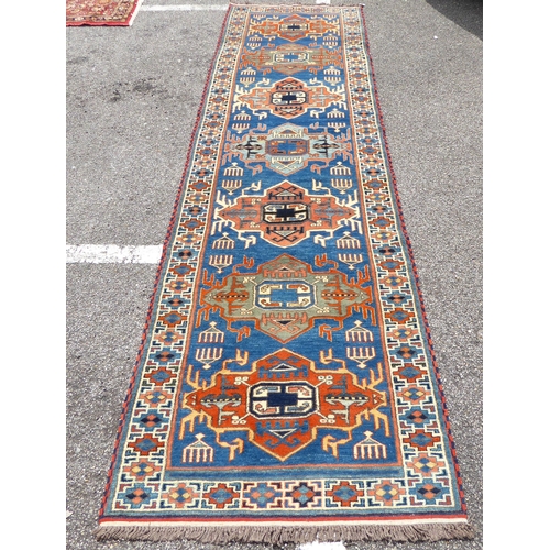 306 - A Khajli style runner, on a multi-coloured ground  34