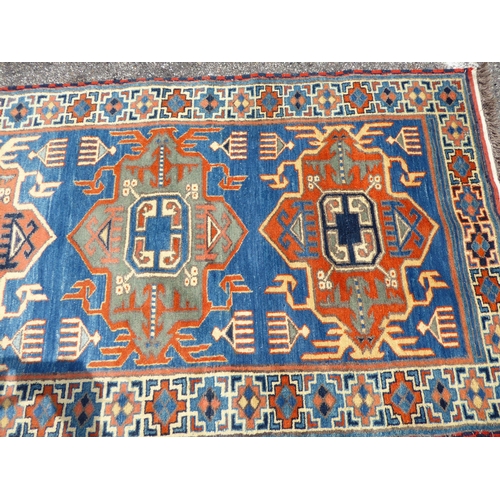 306 - A Khajli style runner, on a multi-coloured ground  34