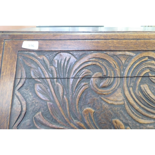 316 - An early 20thC carved oak bureau, the fall front over four long drawers, on a plinth  40.5