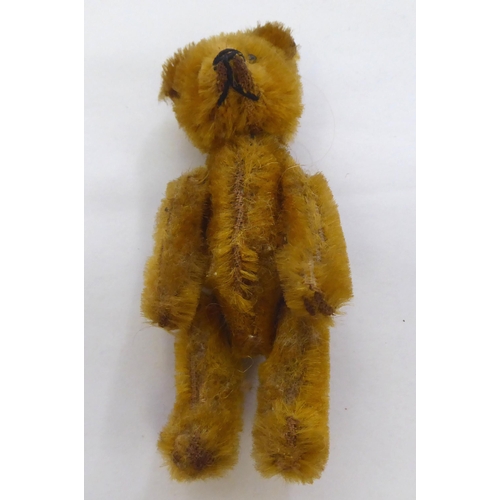 317 - A mixed lot: to include a Schuco Teddy bear perfume bottle  3.5