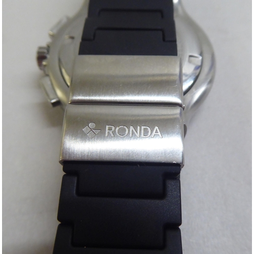 36 - A Ronda stainless steel cased wristwatch, faced by an Arabic dial with three subsidiaries and a date... 