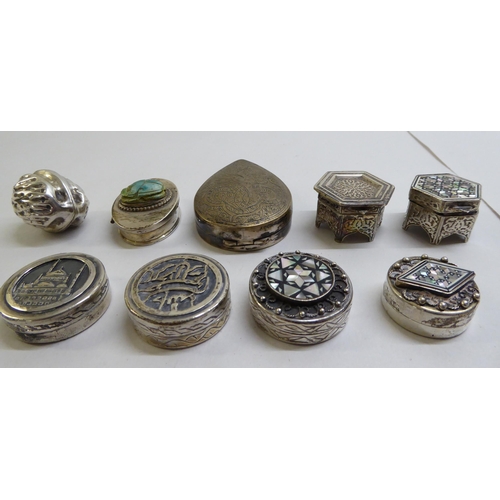 40 - Silver and white metal pill boxes: to include an example fashioned as a walnut