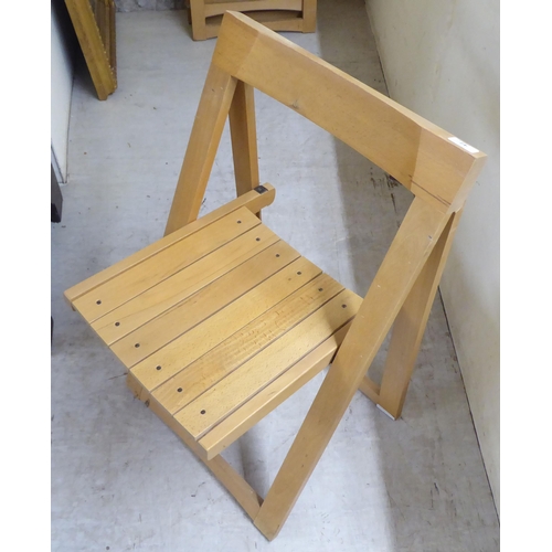 42 - A set of six modern beech framed folding chairs