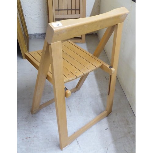 42 - A set of six modern beech framed folding chairs