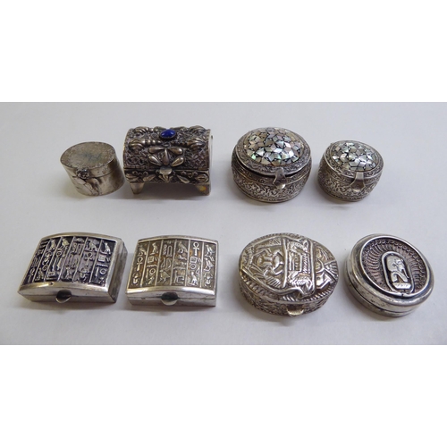 44 - Silver and white metal pill boxes: to include an Egyptian example, decorated with mother-of-pearl