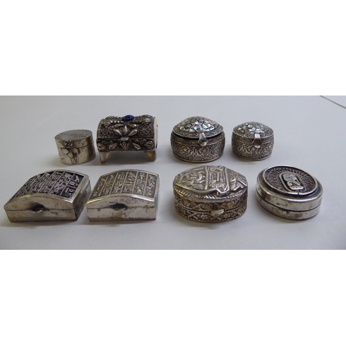 44 - Silver and white metal pill boxes: to include an Egyptian example, decorated with mother-of-pearl