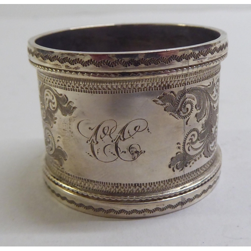 55 - Silver and white metal collectables: to include a late Victorian napkin ring  London 1895