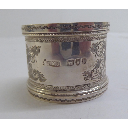 55 - Silver and white metal collectables: to include a late Victorian napkin ring  London 1895