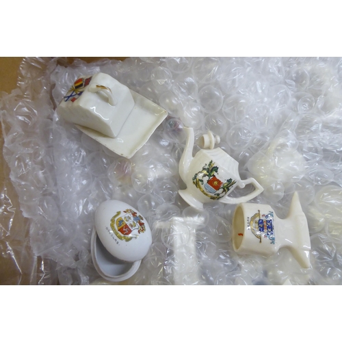 60 - Crested china: to include an example bearing a Swansea emblem