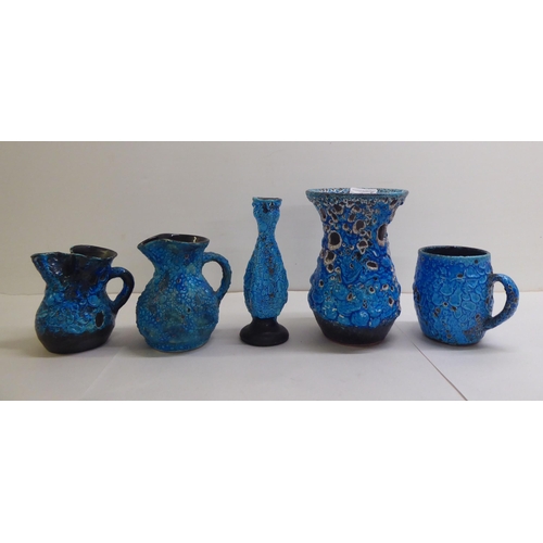 63 - Five items of blue/black Lava pottery: to include a vase  8