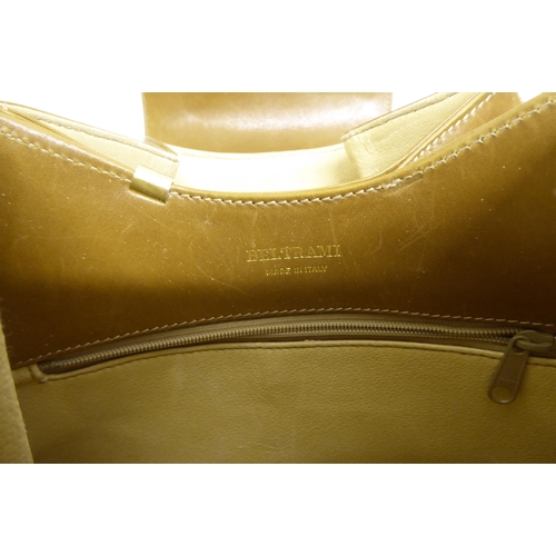 64 - Handbags: to include a brown hide example with gilt metal fittings 