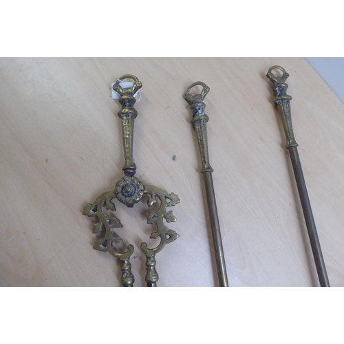 82 - A set of three 19thC brass fireside companions