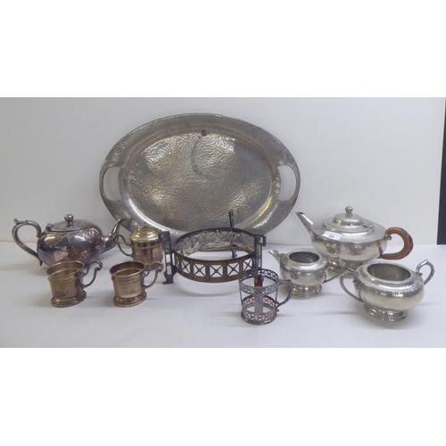 89 - Metalware: to include a spot-hammered pewter, three piece tea set, on a tray  22