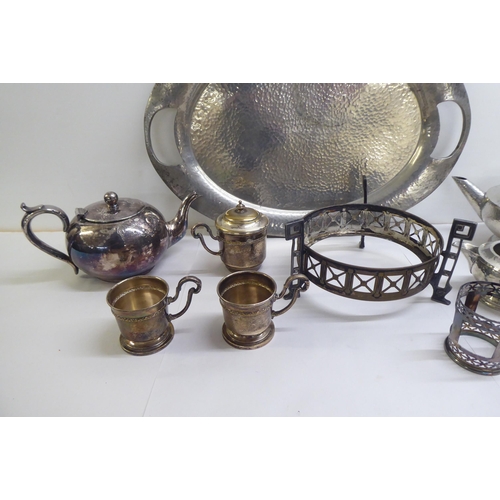 89 - Metalware: to include a spot-hammered pewter, three piece tea set, on a tray  22