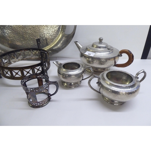 89 - Metalware: to include a spot-hammered pewter, three piece tea set, on a tray  22